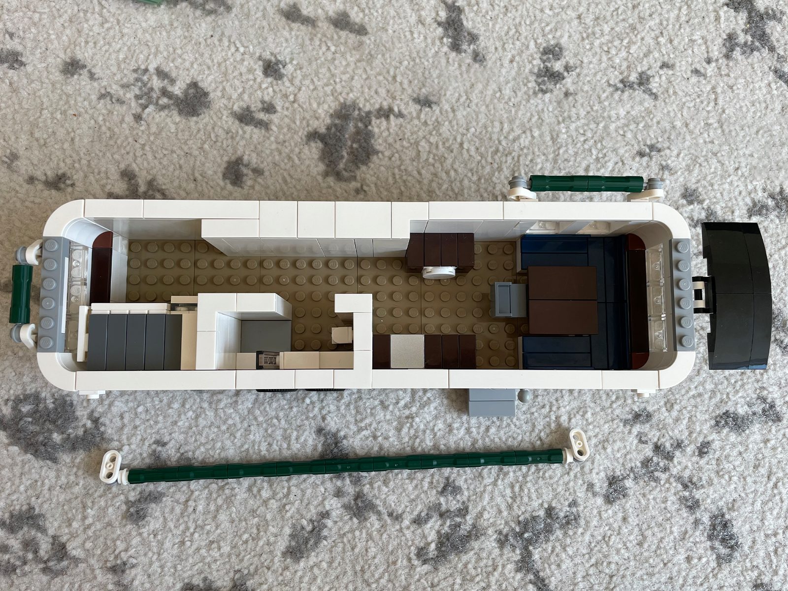 Mecabricks render showing the top-down interior layout of the LEGO Airstream with minifigures