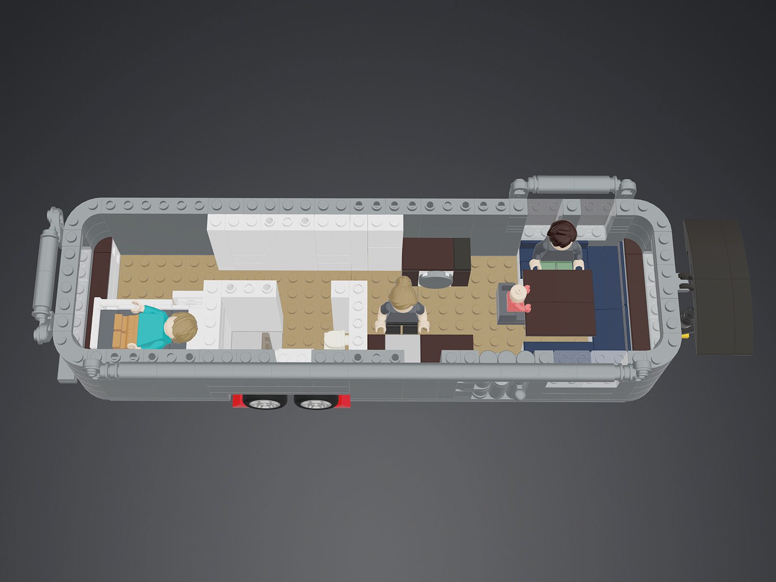 The completed LEGO Airstream model on a shelf, light kit glowing